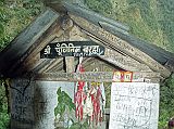 108 Forest Temple Dedicated To Hindu Deity Baraha From Dovan (2540m), it was into the deep forest again, which seemed to go on forever. About 30 minutes from Dovan is a temple dedicated to the Hindu deity Baraha, with offerings of rice, flowers, incense and coins.